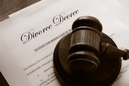 A judge’s gavel resting on a divorce decree